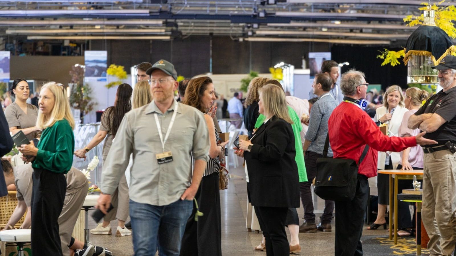 Group of people networking at the Tasmanian Tourism Showcase 2024 which showcases Tasmanias Tourism industries and accommodation options like Motel 429 in Sandy Bay